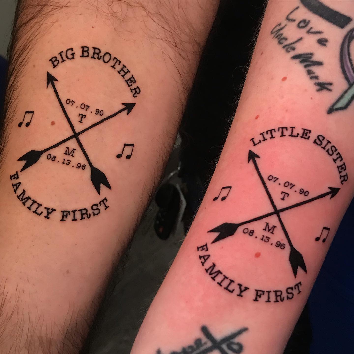 Matching big brother and little sister tattoos with crossed arrows, birth dates, and 'Family First' inscription
